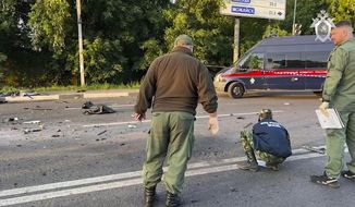 In this handout photo taken from video released by Investigative Committee of Russia on Sunday, Aug. 21, 2022, investigators work on the site of explosion of a car driven by Daria Dugina outside Moscow. Daria Dugina, the daughter of Alexander Dugin, the Russian nationalist ideologist often called &amp;quot;Putin&#x27;s brain&amp;quot;, was killed when her car exploded on the outskirts of Moscow, officials said Sunday. The Investigate Committee branch for the Moscow region said the Saturday night blast was caused by a bomb planted in the SUV driven by Daria Dugina.(Investigative Committee of Russia via AP)