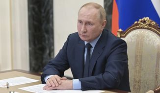 Russian President Vladimir Putin attends a meeting via teleconference call, in Moscow, Russia, Monday, Aug. 22, 2022. (Pavel Byrkin, Sputnik, Kremlin Pool Photo via AP)