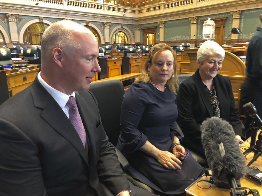 Colorado Republican Sen. Kevin Priola, left, Democratic House Speaker KC Becker, center, and Democratic Sen. Lois Court discuss a proposed ballot initiative to let the state keep excess tax revenue in Denver on March 20, 2019. Citing alarm toward the Republican Party's widespread embrace of 2020 election conspiracies, a moderate GOP Colorado state senator has switched his affiliation to Democrat. Priola's decision, announced on Monday, Aug. 22, 2022, enhances Democrats' chances of retaining their majority in the chamber in the November midterms. (AP Photo/Jim Anderson,File)