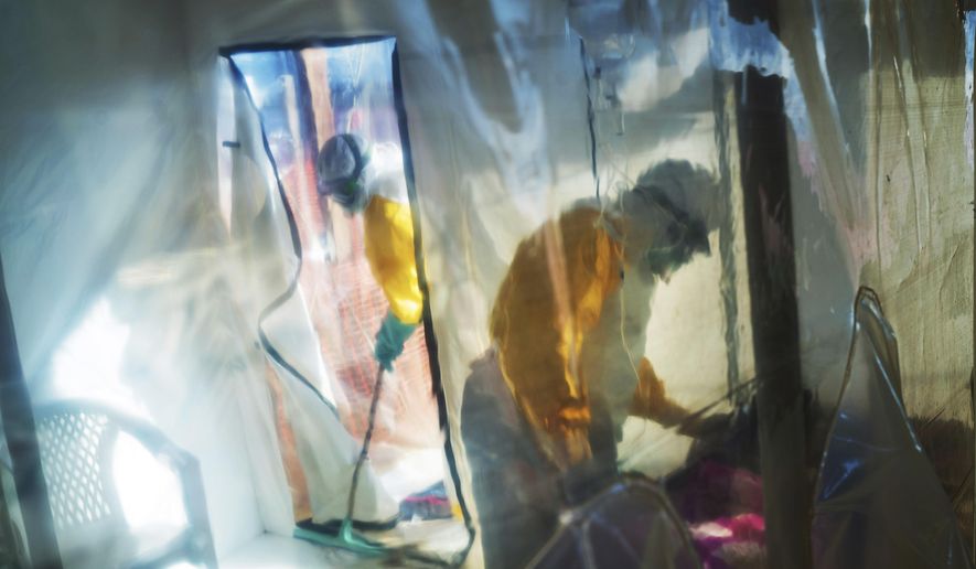 Health workers wearing protective suits tend to an Ebola victim kept in an isolation tent in Beni, Democratic Republic of Congo, on Saturday, July 13, 2019. A new case of the Ebola virus has been confirmed in Congo’s eastern Beni city, Congo’s ministry of health announced Monday, Aug. 22, 2022, saying it is linked to a previous outbreak. (AP Photo/Jerome Delay, File)