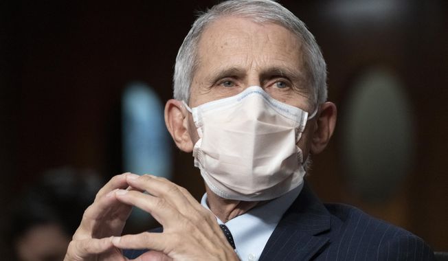 Dr. Anthony Fauci, director of the National Institute of Allergy and Infectious Diseases, listens during opening statements during a Senate Health, Education, Labor, and Pensions Committee hearing on Capitol Hill, Nov. 4, 2021, in Washington. Fauci, the nation&#x27;s top infectious disease expert who became a household name, and the subject of partisan attacks, during the COVID-19 pandemic, announced Monday he will depart the federal government in December after more than 5 decades of service.  (AP Photo/Alex Brandon, File)