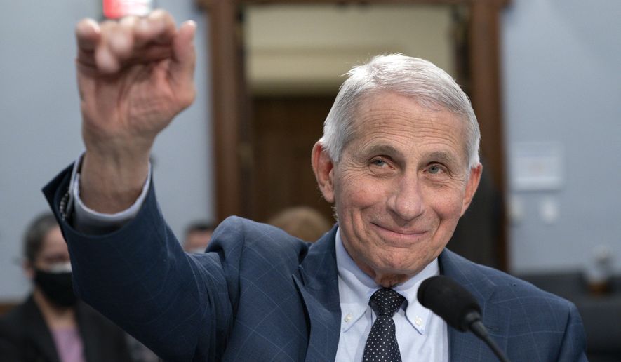 Dr. Anthony Fauci, Director of the National Institute of Allergy and Infectious Diseases, waves hello to the committee at the start of a House Committee on Appropriations subcommittee on Labor, Health and Human Services, Education, and Related Agencies hearing, about the budget request for the National Institutes of Health, May 11, 2022, on Capitol Hill in Washington. Fauci, the nation&#39;s top infectious disease expert who became a household name, and the subject of partisan attacks, during the COVID-19 pandemic, announced Monday he will depart the federal government in December after more than 5 decades of service. AP Photo/Jacquelyn Martin, File)