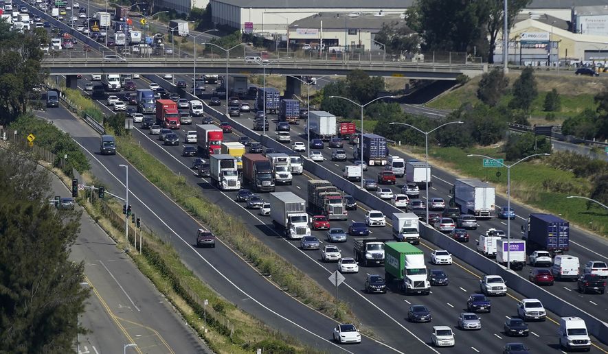 Traffic moves on Interstate 880 in Oakland, Calif., Tuesday, Aug. 16, 2022. (AP Photo/Jeff Chiu) ** FILE **