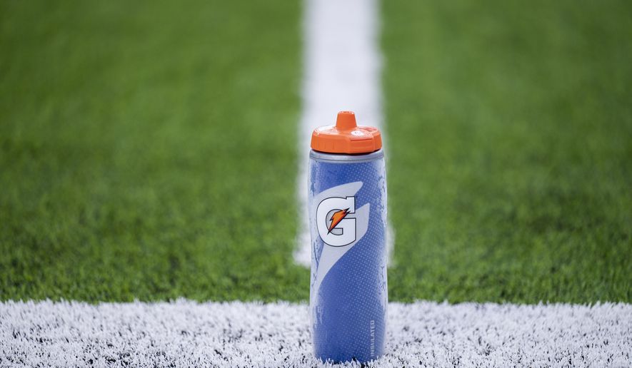 Detail of a Gatorade bottle on the field before an NFL preseason football game between the Los Angeles Rams and the Houston Texans Friday, Aug. 19, 2022, in Inglewood, Calif. (AP Photo/Kyusung Gong)