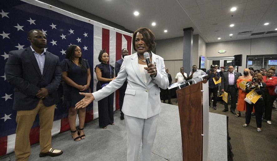 U.S. Rep. Val Demings, D-Fla., center, the Democratic candidate for the U.S. Senate, addresses supporters as her family members stand behind her during a primary election party on Tuesday, Aug. 23, 2022, in Orlando, Fla. (AP Photo/Phelan M. Ebenhack)
