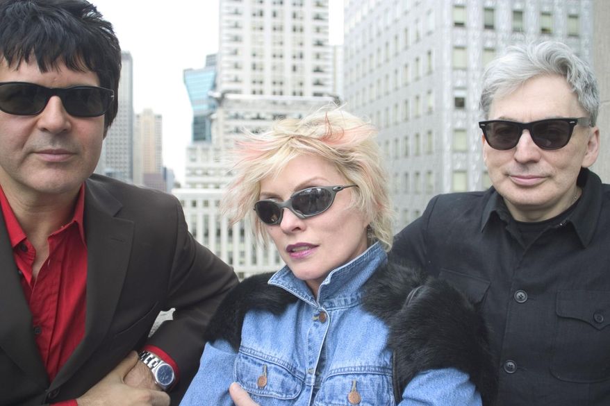 Clem Burke, from left, Deborah Harry and Chris Stein, members of the rock group Blondie, pose for a photo in New York, on April 8, 2004. The band is releasing a box set  “Blondie: Against the Odds, 1974-1982,” with 124 tracks and 36 previously unissued recordings, demos, outtakes and Blondie’s initial six studio albums. (AP Photo/Justin Walters, File)