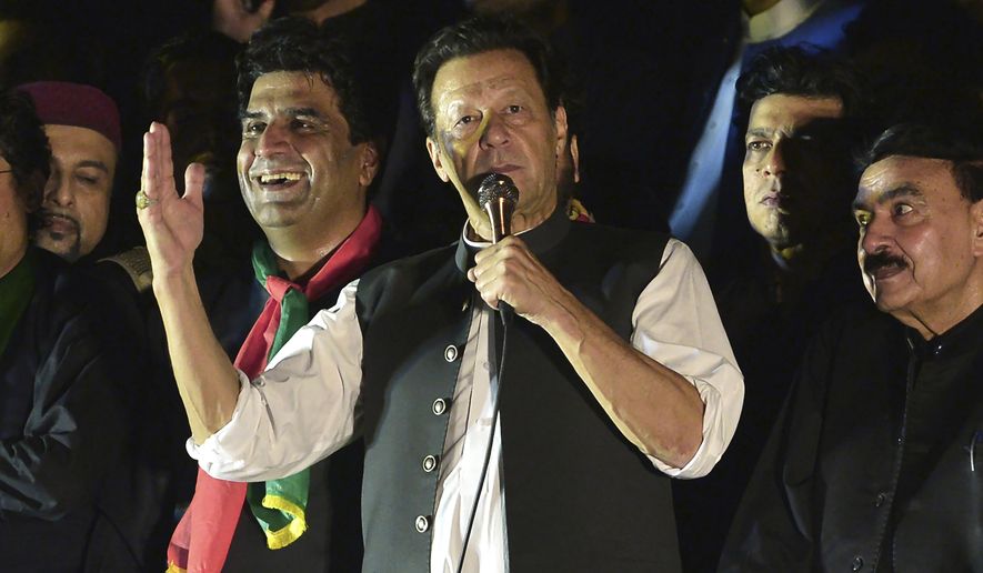 Pakistan&#39;s former Prime Minister Imran Khan, center, addresses during an anti-government rally in Islamabad, Pakistan, Saturday, Aug. 20, 2022. A Pakistani court on Tuesday, Aug. 23, 2022, was expected to initiate contempt proceedings against Khan for threatening a judge in a recent rally speech as pressure on the ousted premier intensified with police raiding the apartment of his close aide in the capital, and taking the associate away for interrogation. (AP Photo/W.K. Yousafzai)