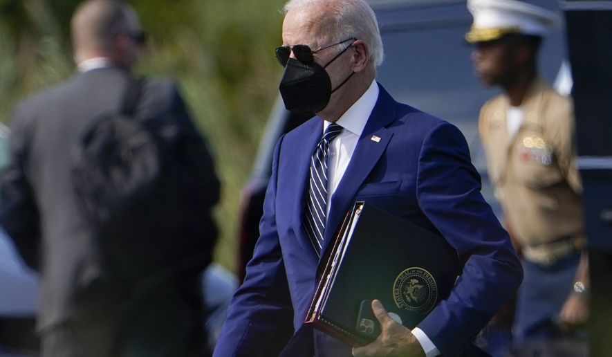 President Joe Biden arrives to board Marine One at Gordons Pond State Park in Rehoboth Beach, Del., Wednesday, Aug. 24, 2022, to travel back to the White House. (AP Photo/Manuel Balce Ceneta)