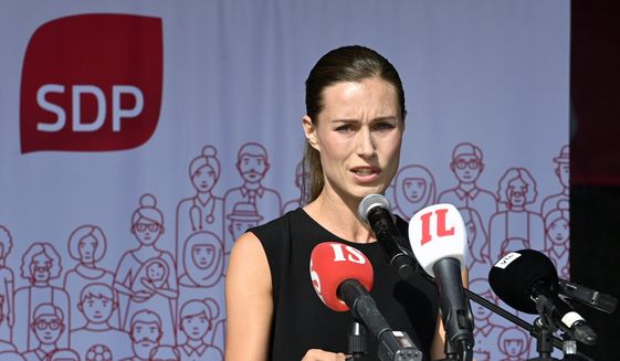 Finnish Prime Minister Sanna Marin speaks during a meeting of Social Democratic party of Finland in Lahti, Finland, Wednesday Aug. 24, 2022. Marin apologized Wednesday after the publication of a photo that showed two women kissing and posing topless at the official summer residence of the country&#39;s leader. (Heikki Saukkomaa/Lehtikuva via AP)