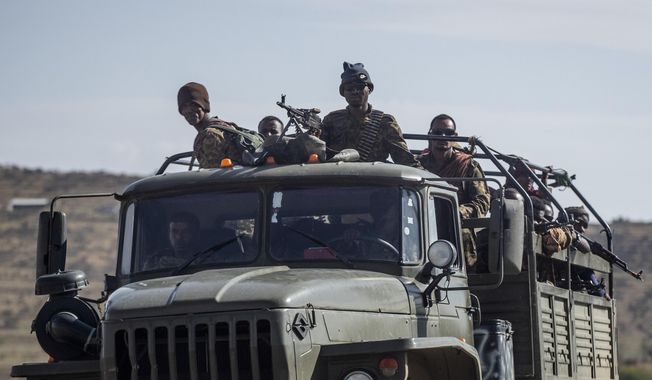FILE - Ethiopian government soldiers ride in the back of a truck on a road near Agula, north of Mekele, in the Tigray region of northern Ethiopia on May 8, 2021. Authorities in Ethiopia&#x27;s northern Tigray region alleged Wednesday, Aug. 24, 2022 that Ethiopia&#x27;s military launched a &amp;quot;large-scale&amp;quot; offensive for the first time in a year, while Ethiopia&#x27;s military spokesman did not immediately respond to questions. (AP Photo/Ben Curtis, File)