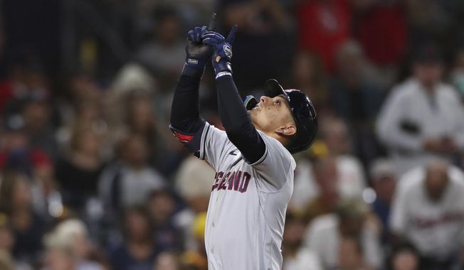 Cleveland Guardians&#x27; Andres Gimenez points to the sky as he nears the plate after hitting a solo home run against the San Diego Padres in the fifth inning of a baseball game Tuesday, Aug. 23, 2022, in San Diego. (AP Photo/Derrick Tuskan)