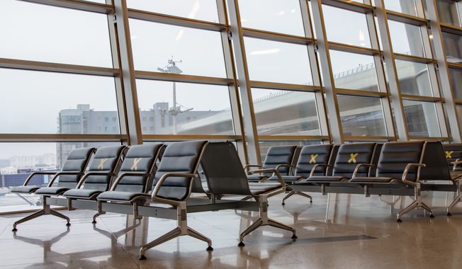 Empty chairs at an airport (Galina-Photo via Shutterstock) **FILE**