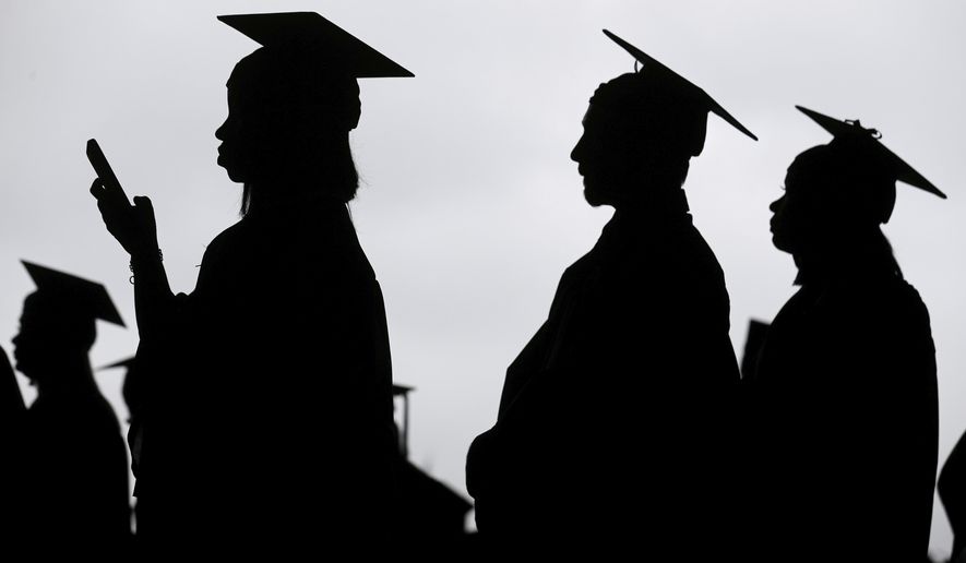 FILE - New graduates line up before the start of a community college commencement in East Rutherford, N.J., on May 17, 2018. President Joe Biden is expected to announce Wednesday Aug. 24, 2022 that many Americans can have up to $10,000 in federal student loan debt forgiven. (AP Photo/Seth Wenig, File)