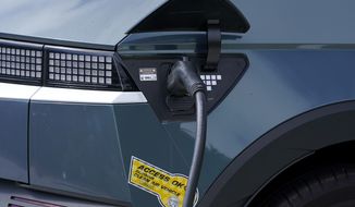 A car is parked at an electric charging station in San Francisco, Thursday, Aug. 25, 2022. California is poised to required 100% of new cars, trucks and SUVs sold in the state to be powered by electricity or hydrogen by 2035. (AP Photo/Jeff Chiu)