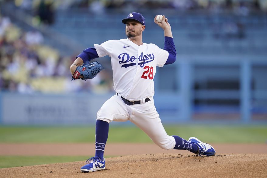 Los Angeles Dodgers starting pitcher Andrew Heaney (28) throws during the first inning of a baseball game against the Milwaukee Brewers in Los Angeles, Wednesday, Aug. 24, 2022. (AP Photo/Ashley Landis)