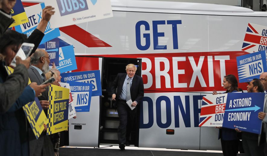 Britain&#39;s Prime Minister Boris Johnson addresses his supporters prior to boarding his General Election campaign trail bus in Manchester, England, Friday, Nov. 15, 2019. The moving vans have already started arriving in Downing Street, as Britain&#39;s Conservative Party prepares to evict Johnson. Debate about what mark he will leave on his party, his country and the world will linger long after he departs in September. (AP Photo/Frank Augstein, Pool, File)