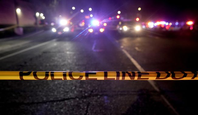 A police tape blocks a road near the scene where a Sacramento County Sheriff&#x27;s deputy was shot and a suspect was shot and killed in the Sacramento suburb of Carmichael, Calif., Friday, Jan. 15, 2021. Homicides in California rose again last year, as did other violent crimes, amid rising frustration as the state&#x27;s top Democrats are seeking to keep their jobs in upcoming elections. (AP Photo/Rich Pedroncelli, File)