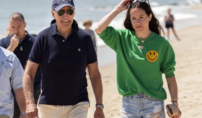 President Joe Biden walks on the beach with daughter Ashley Biden, in Rehoboth Beach, Del., June 20, 2022. Two people have pleaded guilty in a scheme to peddle a diary and other items belonging to President Joe Biden&#x27;s daughter Ashley to the conservative group Project Veritas, prosecutors said Thursday, Aug. 25, 2022. (AP Photo/Manuel Balce Ceneta, File)