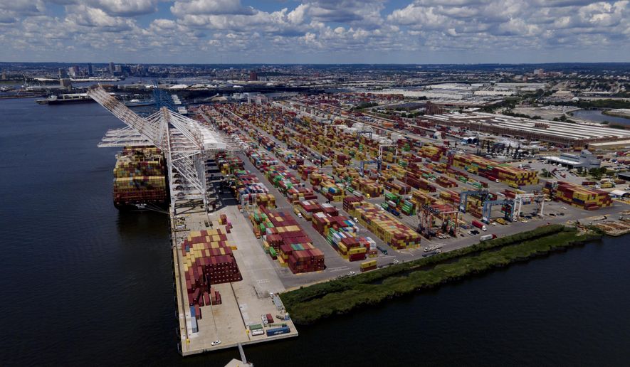 Shipping containers are stacked together at the Port of Baltimore, Friday, Aug. 12, 2022, in Baltimore. During the summer, a massive container ship pulled into port loaded with sheets of plywood, aluminum rods and radioactive material – all sourced from the fields, forests and factories of Russia. (AP Photo/Julio Cortez)