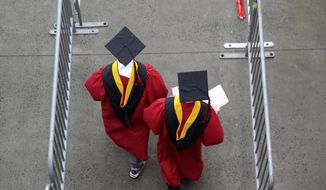 New graduates walk into the High Point Solutions Stadium before the start of the Rutgers University graduation ceremony in Piscataway Township, N.J., on May 13, 2018. President Joe Biden’s student loan cancellation offers a life-changing financial break for millions of Americans. But for future students heading to college under the same conditions that created today’s debt, critics say it offers little help. Chief among the causes of today&#39;s rising student debt is the cost of college. (AP Photo/Seth Wenig, File)