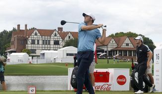 Scottie Scheffler tees off on the sixteenth hole during the first round of the Tour Championship golf tournament at East Lake Golf Club, Thursday, Aug. 25, 2022, in Atlanta. (Jason Getz/Atlanta Journal-Constitution via AP)