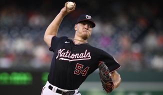 Washington Nationals starting pitcher Cade Cavalli throws during the first inning of a baseball game against the Cincinnati Reds, Friday, Aug. 26, 2022, in Washington. Cavalli is making his MLB debut. (AP Photo/Nick Wass)