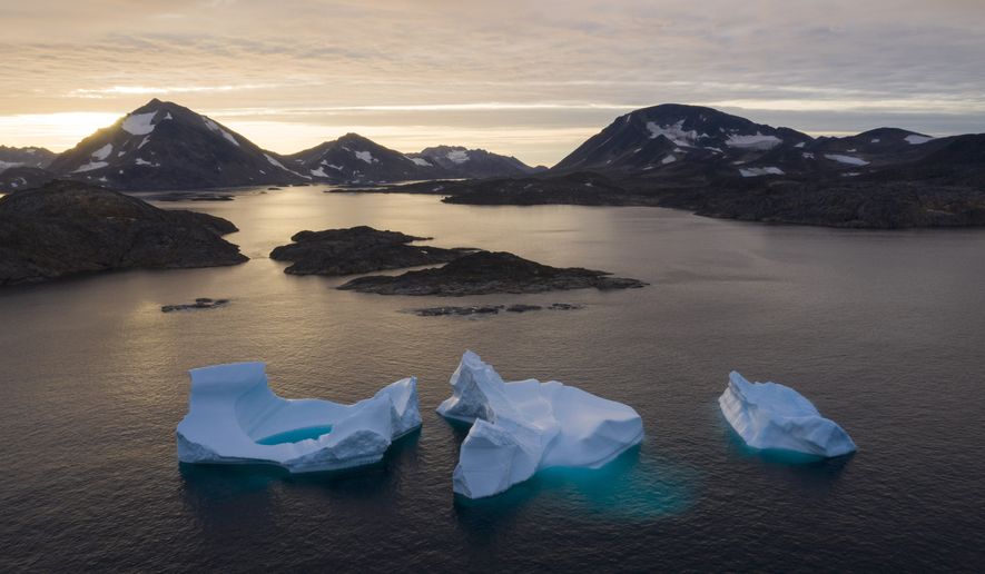 Large Icebergs float away as the sun rises near Kulusuk, Greenland, Aug. 16, 2019. The Biden administration said Friday, Aug. 26, 2022, that it will upgrade its engagement with the Arctic Council and countries with an interest in a region that&#39;s rapidly changing due to climate change. (AP Photo/Felipe Dana, File)  **FILE**