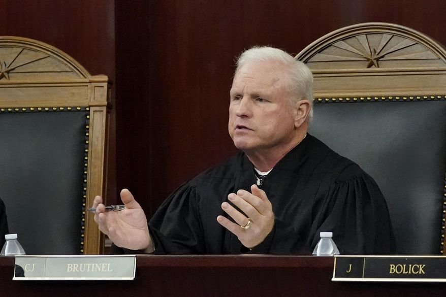 Arizona Supreme Court Chief Justice Robert M. Brutinel speaks during oral arguments, in Phoenix on April 20, 2021. The Arizona Supreme Court will review a lower court's decision to keep a voter initiative rolling back Republican-backed election law changes and expanding voting access on the ballot and could decide to block it after all. (AP Photo/Matt York, File)