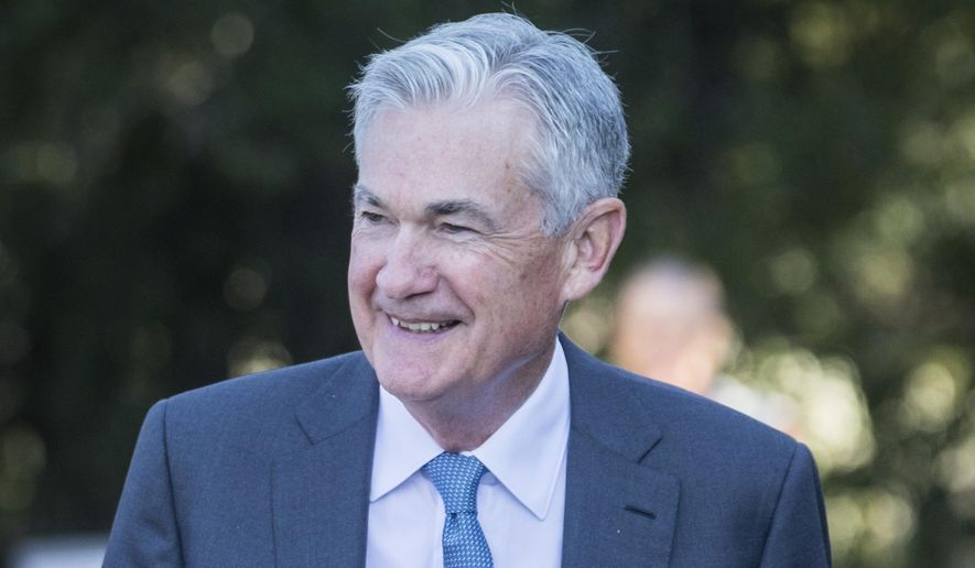 Federal Reserve Chair Jerome Powell smiles and walks after his speech at the central bank&#39;s annual symposium at Jackson Lake Lodge in Grand Teton National Park Friday, Aug. 26, 2022. in Moran, Wyo. (AP Photo/Amber Baesler)