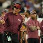 Washington Commanders head coach Ron Rivera stands on the sideline in the first half of a preseason NFL football game against the Baltimore Ravens, Saturday, Aug. 27, 2022, in Baltimore. (AP Photo/Julio Cortez)