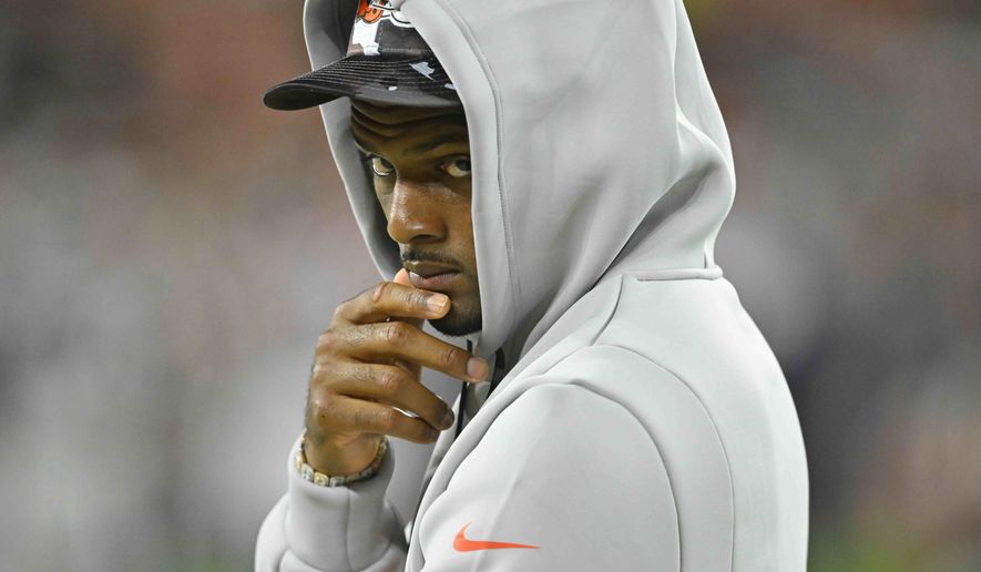 Cleveland Browns quarterback Deshaun Watson (4) walks along the sideline during the second half of an NFL preseason football game against the Chicago Bears, Saturday, Aug. 27, 2022, in Cleveland. (AP Photo/David Richard)
