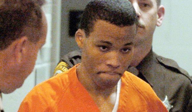 In a Tuesday, Oct.26, 2004 photo, convicted sniper Lee Boyd Malvo enters a courtroom in the Spotsylvania Circuit Court in Spotsylvania, Va. Maryland’s highest court has ruled, Friday, Aug. 27, 2022, that Malvo must be resentenced, because of U.S. Supreme Court decisions relating to constitutional protections for juveniles made after Malvo was sentenced to six life sentences without the possibility of parole.  (Mike Morones/The Free Lance-Star via AP, File)  **FILE**