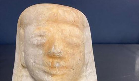 This photo provided by  U.S. Customs and Border Protection shows an ancient Egyptian artifact. Federal agents in Memphis have seized the potentially 3,000-year-old ancient Egyptian artifact that was shipped in from Europe.  U.S. Customs and Border Protection says they intercepted the Egyptian canopic jar lid of the funeral deity named Imsety on Aug. 17, 2022.  The jars were used to hold the internal organs of mummies.  ( U.S. Customs and Border Protection via AP)