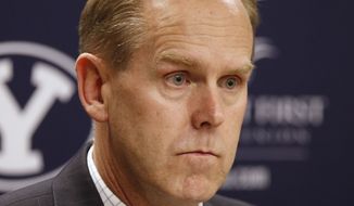 Brigham Young University athletic director Tom Holmoe listens to a question during a news conference in Provo, Utah, Thursday, March 3, 2011, about the dismissal of Brandon Davies from the men&#39;s basketball team for breaking the school&#39;s honor code. (AP Photo/George Frey) **FILE**