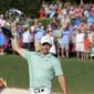 Rory McIlroy celebrates with the trophy after winning the Tour Championship golf tournament at East Lake Golf Club Sunday, Aug. 28, 2022, in Atlanta. (Jason Getz/Atlanta Journal-Constitution via AP)