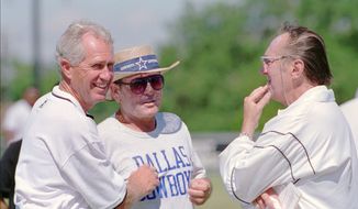 Dallas Cowboys offensive coordinator Ernie Zampese, center, talks with Oakland Raiders head football coach Mike White, left, and Raiders owner Al Davis, right, after the teams worked out in Austin, Texas, Aug. 1, 1995. Zampese, one of the architects of the Dan Fouts-led &quot;Air Coryell&quot; offense with the San Diego Chargers and Troy Aikman&#39;s play-caller for the last of the Cowboys&#39; three Super Bowl titles in the 1990s, has died. He was 86. (AP Photo/Harry Cabluck, File) **FILE**