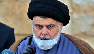 Influential Shiite cleric Muqtada al-Sadr speaks during a press conference in Najaf, Iraq, Feb. 10, 2021. Al-Sadr who&#39;s followers have been staging a sit-in outside Iraq&#39;s parliament announced his resignation from politics and the closure of his party&#39;s offices on Monday, Aug. 29, 2022. It is an unexpected plot twist more than four weeks after his supporters stormed the parliament building to prevent his Iran-backed rivals from forming a government. (AP Photo/Anmar Khalil, File)