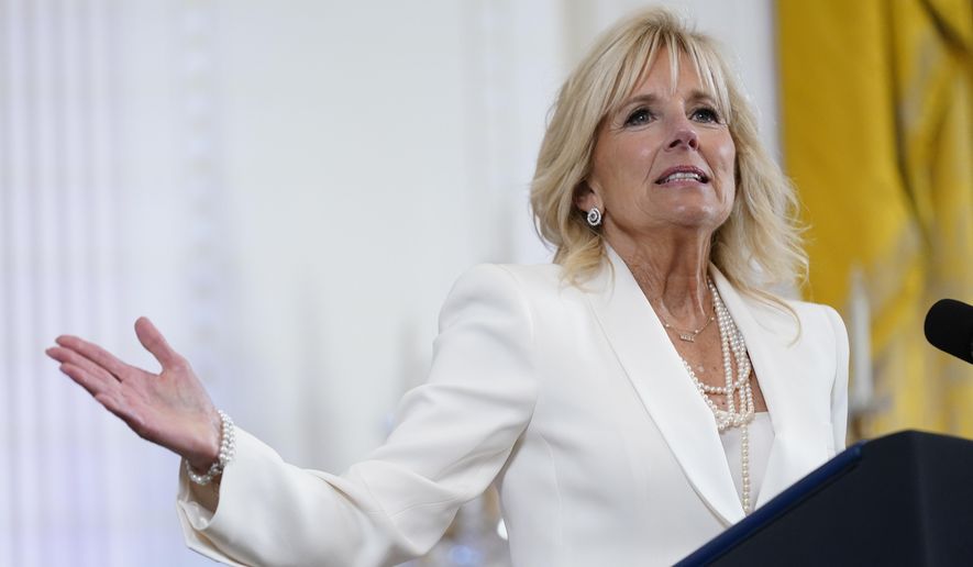 First lady Jill Biden speaks at an event in the East Room of the White House, June 15, 2022, in Washington. White House says the first lady has tested negative for COVID-19 and will return to the Washington, area on Tuesday, Aug. 30. (AP Photo/Patrick Semansky, File)