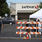 The Forum Shopping Center in Bend, Ore. remained closed Monday, Aug. 29, 2022 as police investigated a shooting at the Safeway there that left two people and the suspected gunman dead Sunday night. (Dave Killen/The Oregonian via AP)