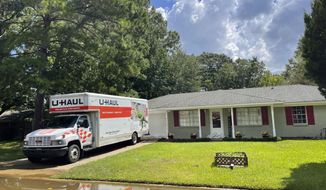 Residents in the North Canton Circle neighborhood of Jackson, Miss., on Monday, Aug. 29, 2022, were advised to evacuate from impending floodwaters. Some moved out all of their possessions in U-Haul trucks or cars. (AP Photo/Michael Goldberg)