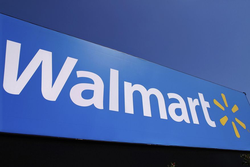 The Walmart logo is displayed on a store in Springfield, Ill., May 16, 2011. Walmart filed a motion on Monday, Aug. 29, 2022, to dismiss a lawsuit by the Federal Trade Commission in June that accused the nation&#x27;s largest retailer of allowing its money transfer services to be used by scam artists, calling it an “egregious instance of agency overreach.” (AP Photo/Seth Perlman, File)