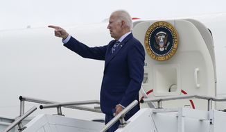 President Joe Biden points before boarding Air Force One at Wilkes-Barre Scranton International airport, Tuesday, Aug. 30, 2022, in Avoca, Pa. (AP Photo/Evan Vucci)