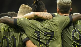 AC Milan&#39;s Rafael Leao, centre, celebrates with his teammates after scoring his side&#39;s opening goal during a Serie A soccer match between AC Milan and Bologna at the San Siro stadium in Milan, Italy, Saturday, Aug. 27, 2022. (AP Photo/Luca Bruno)