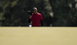 Tiger Woods tips his cap as he walks to the 18th green during the final round at the Masters golf tournament on Sunday, April 10, 2022, in Augusta, Ga. Max Homa says the moment illustrated someone who doesn&#39;t need money playing because of passion. (AP Photo/Jae C. Hong, File) **FILE**