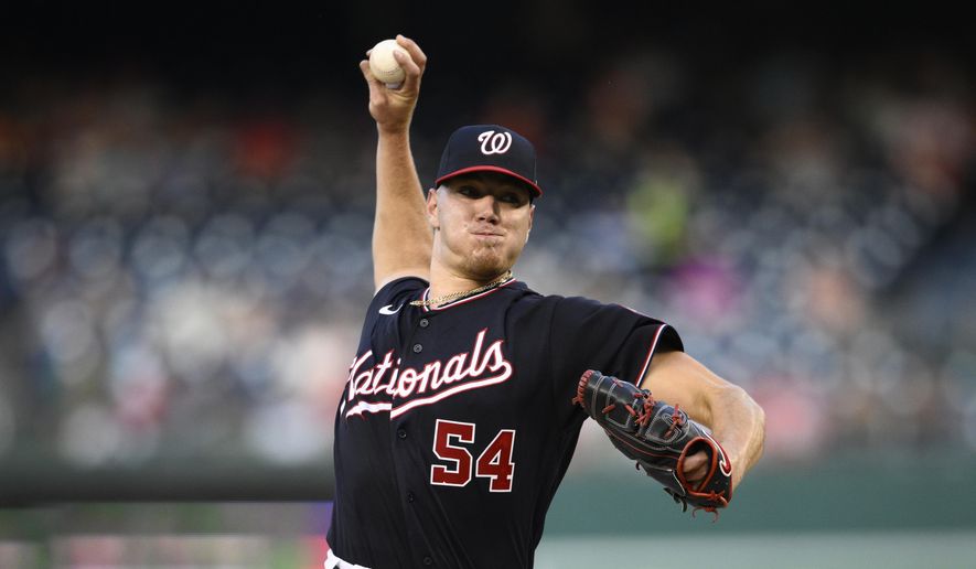 Washington Nationals starting pitcher Cade Cavalli throws during the first inning of a baseball game against the Cincinnati Reds, Friday, Aug. 26, 2022, in Washington. Cavalli is making his MLB debut. (AP Photo/Nick Wass) **FILE**