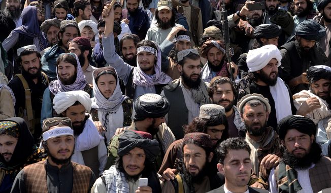 Taliban fighters and supporters celebrate the first anniversary of the withdrawal of US-led troops from Afghanistan, in front of the U.S. Embassy in Kabul, Afghanistan, Wednesday, Aug. 31, 2022. (AP Photo/Ebrahim Noroozi) ** FILE **