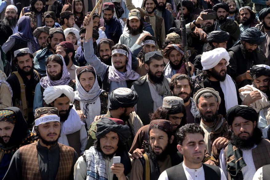 Taliban fighters and supporters celebrate the first anniversary of the withdrawal of US-led troops from Afghanistan, in front of the U.S. Embassy in Kabul, Afghanistan, Wednesday, Aug. 31, 2022. (AP Photo/Ebrahim Noroozi) ** FILE **