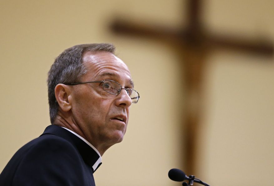 Bishop Charles Thompson speaks after he is introduced as the new archbishop of Indianapolis on June 13, 2017, in Indianapolis. The Indiana Supreme Court ruled Wednesday, Aug. 31, 2022, that religious freedom rights protect the Roman Catholic Archdiocese of Indianapolis from being sued by a teacher who was fired from his job at a Catholic high school for being in a same-sex marriage. (AP Photo/Michael Conroy, File) **FILE**