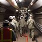 In this photo provided by the U.S. Navy, Rear Adm. John Korka, Commander, Naval Facilities Engineering Systems Command (NAVFAC), and Chief of Civil Engineers, leads Navy and civilian water quality recovery experts through the tunnels of the Red Hill Bulk Fuel Storage Facility, near Pearl Harbor, Hawaii, on Dec. 23, 2021. The U.S. Navy &quot;harbored toxic secrets&quot; when jet fuel contaminated drinking water for 93,000 military members and civilians in Hawaii, four families said in a lawsuit filed Wednesday, Aug. 31, 2022, claiming they continue to suffer maladies such as seizures, gastrointestinal disorders and neurological issues. (Mass Communication Specialist 1st Class Luke McCall/U.S. Navy via AP) **FILE**