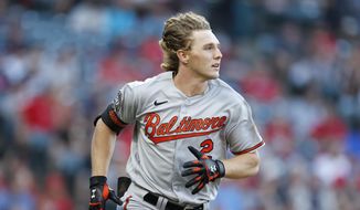 Baltimore Orioles&#39; Gunnar Henderson watches his solo home run off of Cleveland Guardians starting pitcher Triston McKenzie for his first hit in his Major League debut during the fourth inning of a baseball game Wednesday, Aug. 31, 2022, in Cleveland. (AP Photo/Ron Schwane)